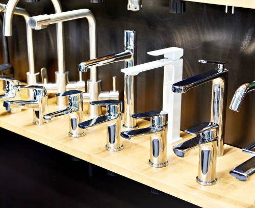 Modern kitchen and bathroom water faucets in the store