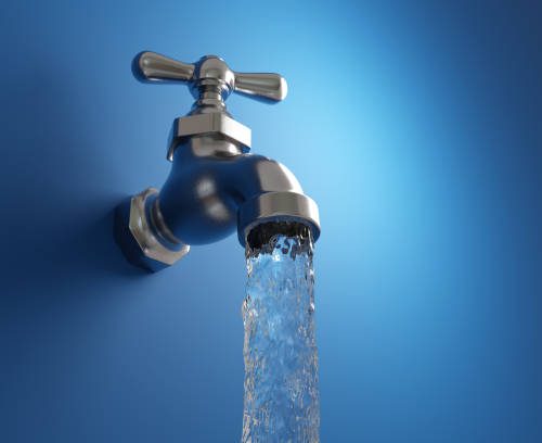 Clear drinking water flowing from an old-fashioned water tap on blue wall. Illustration of the concept of water supply and natural resources